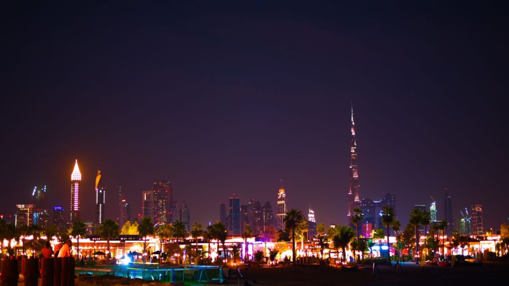 The Art of Drawing Readers In: Your attractive post title goes here Stunning view of Dubai's illuminated skyline at night featuring the Burj Khalifa.